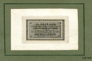 Ein Foto Rahmen mit einer Aktienurkunde mit dem Text "J.R. Roberts, Inc." und verschiedenen Zahlen.