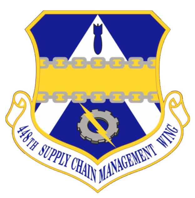 Logo des 48. Versorgungsgeschwader mit einem blauen Schild mit einem weißen Stern, einem weißen Banner mit der Aufschrift "Versorgungsgeschwader" in Blau und dem Text "48. Versorgungsgeschwader" in fetter schwarzer Schrift.