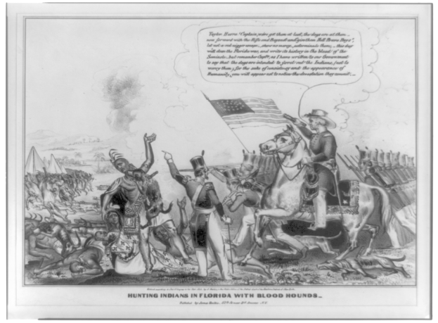 Schwarzes und weißes Foto einer Gruppe von Menschen, einige zu Pferde, mit einer Flagge im Hintergrund und der Beschriftung "Jagen von Indianern in Florida mit Bluthunden" unten.
