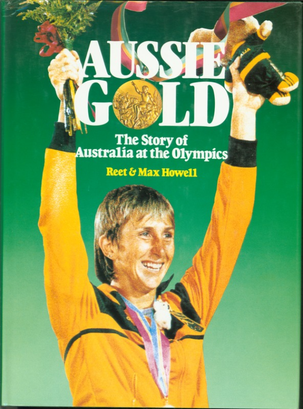 Ein Buch mit dem Titel "Aussie Gold: The Story of Australia at the Olympics" mit einer Person, die einen Blumenstrauß hält und eine Goldmedaille trägt.